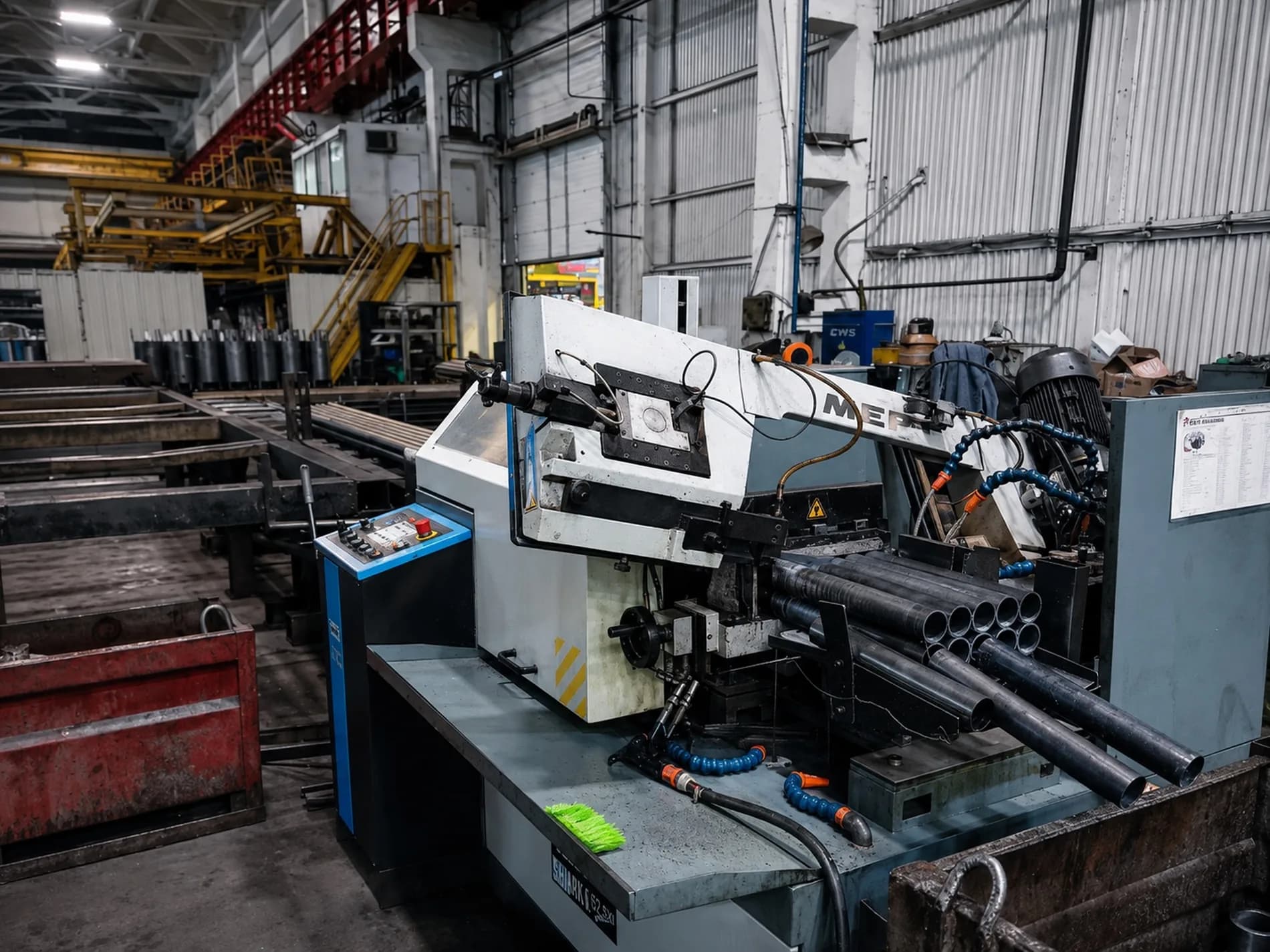 Band saw cutting boiler tubes to length